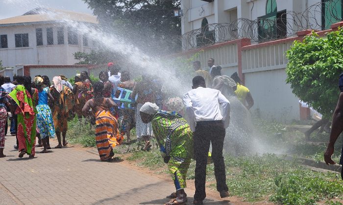 Some of the supporters took to their heels after police scared them off with water canon. Picture: SAMUEL TEI ADANO